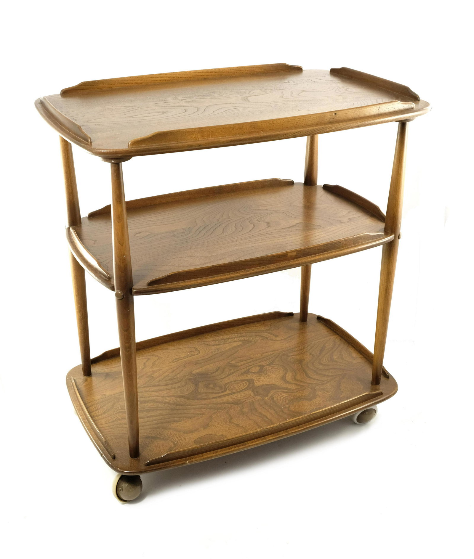 Lucian Ercolani for Ercol, a Windsor golden elm and ash: Lucian Ercolani for Ercol, a Windsor golden elm and ash three tier drinks trolley or serving table, model 458, designed circa 1960, cushioned rectangular and galleried shelves on shaped supports and s