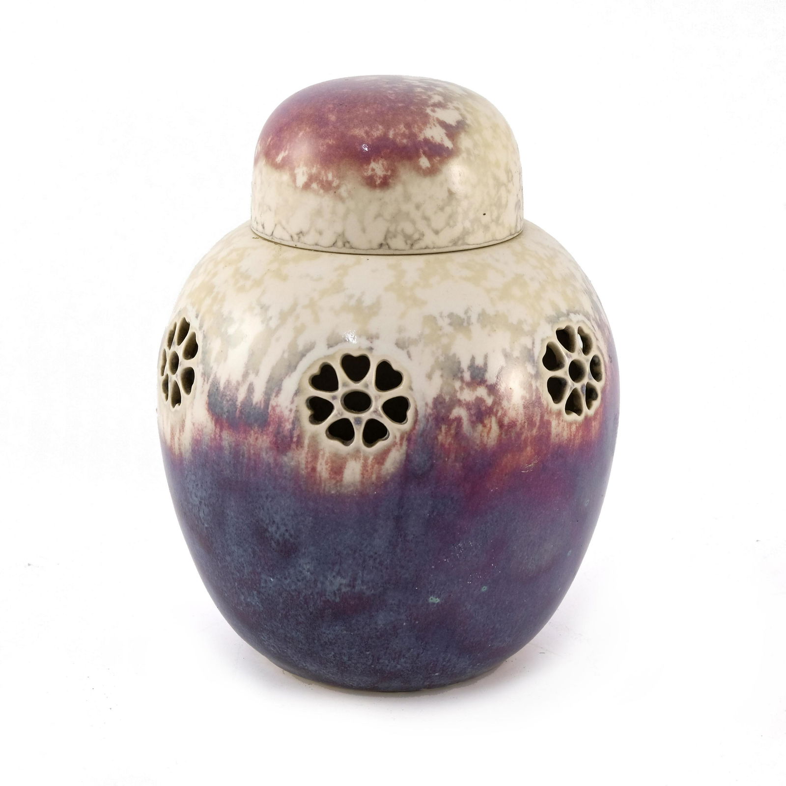 Ruskin Pottery, a High Fired ginger jar: Ruskin Pottery, a High Fired ginger jar and cover, 1927, ovoid form pierced with six floral motifs of six heart shaped petals, band of marbled grey over mottled purple and sang de boeuf with green spe