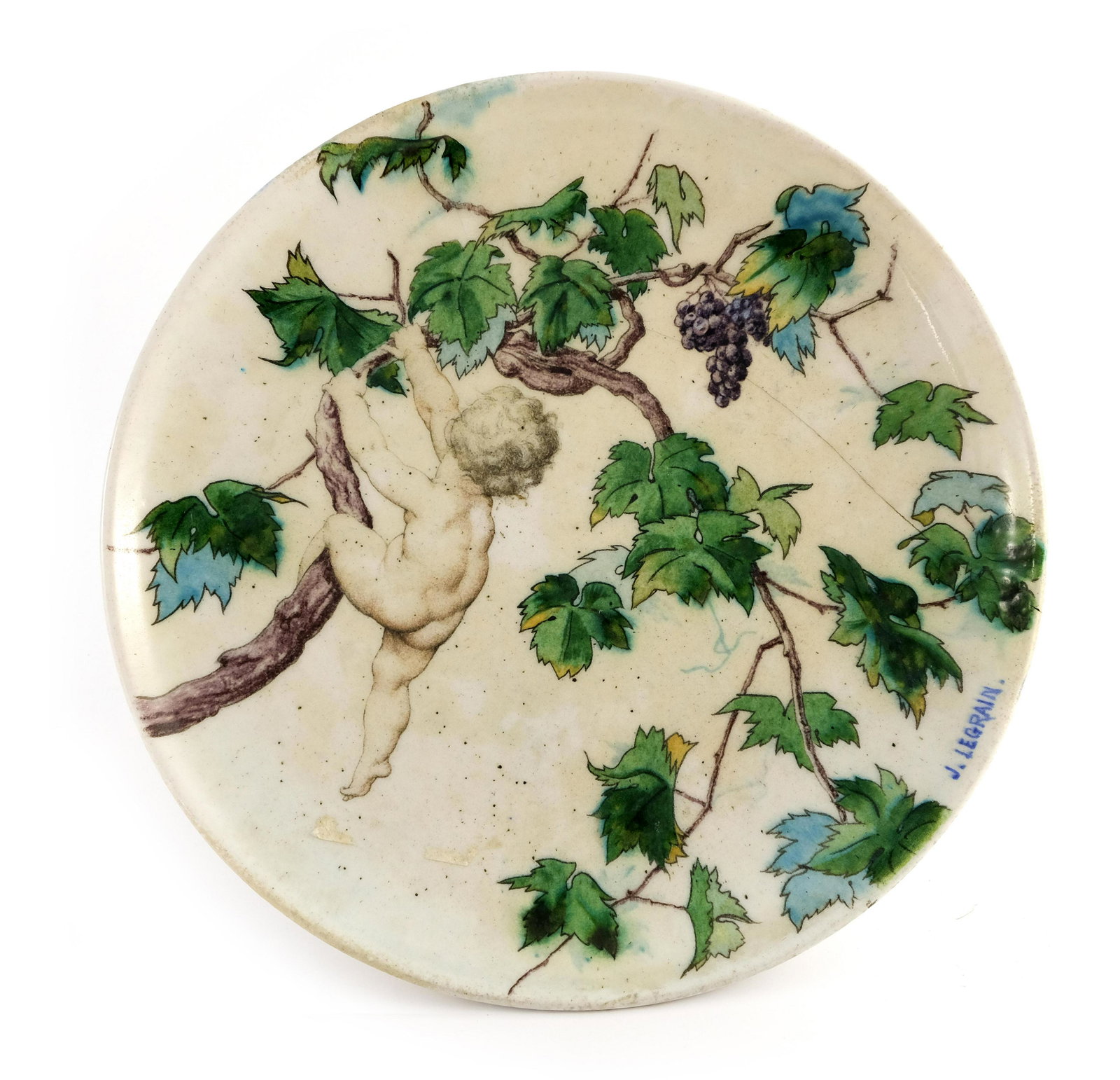 Jules Antoine Legrain for Theodore Deck,: Jules Antoine Legrain for Theodore Deck, a painted charger, 1865, circular form decorated with a putto climbing a fruiting grape vine, signed, painted marks verso, 30cm diameter