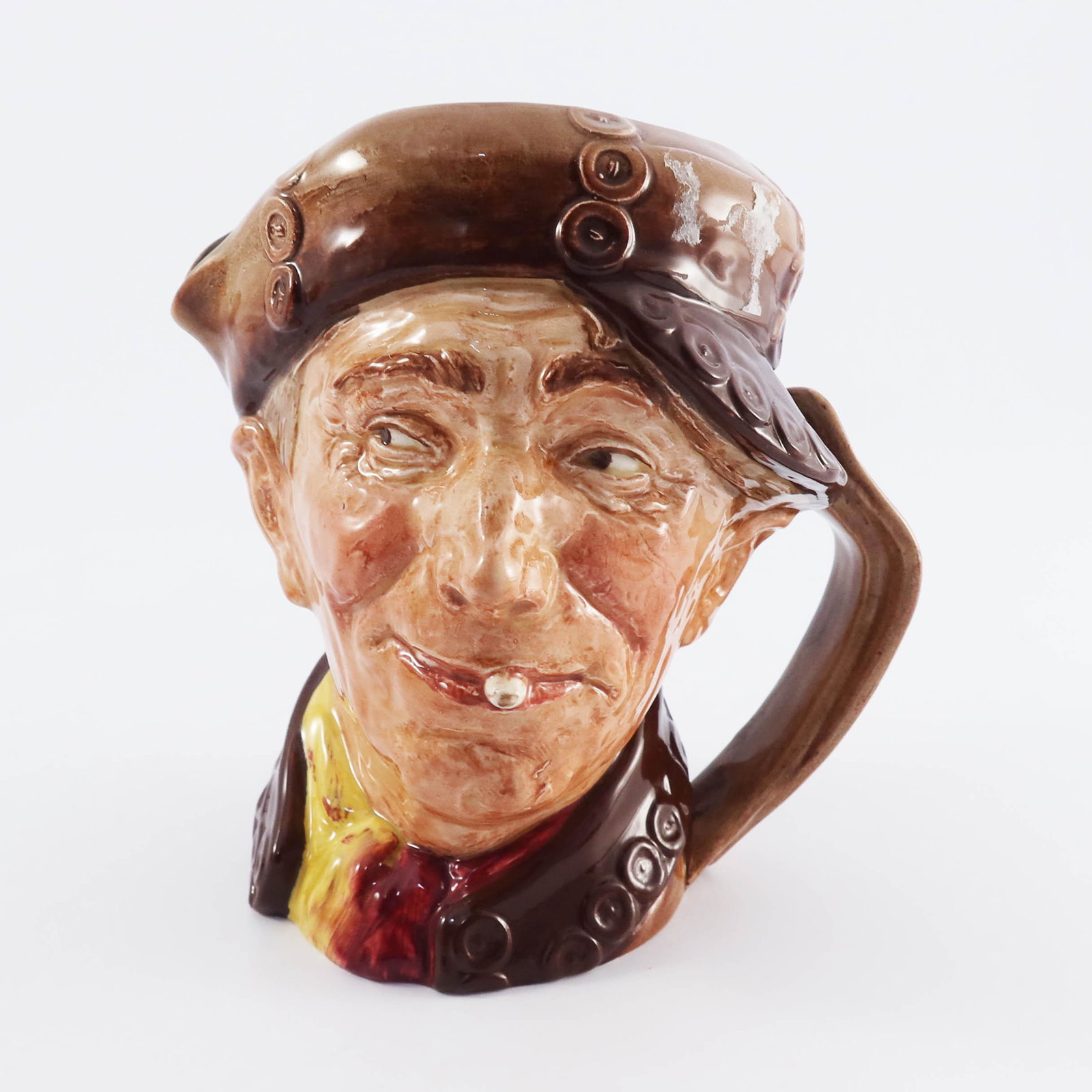 A Royal Doulton character jug, Pearly Bo: A Royal Doulton character jug, Pearly Boy, with brown buttons, printed marks, 16.5cm high