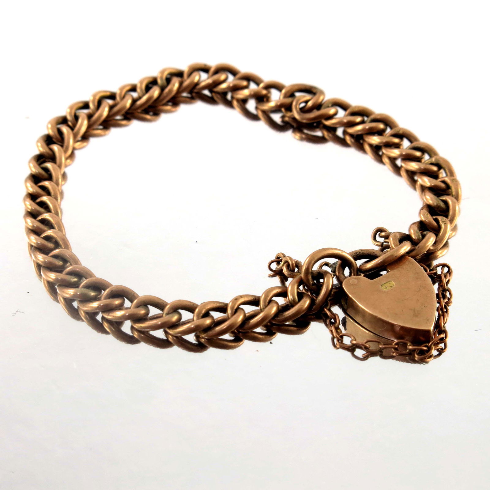 An early 20th century 9ct gold curb-link (1 of 2)