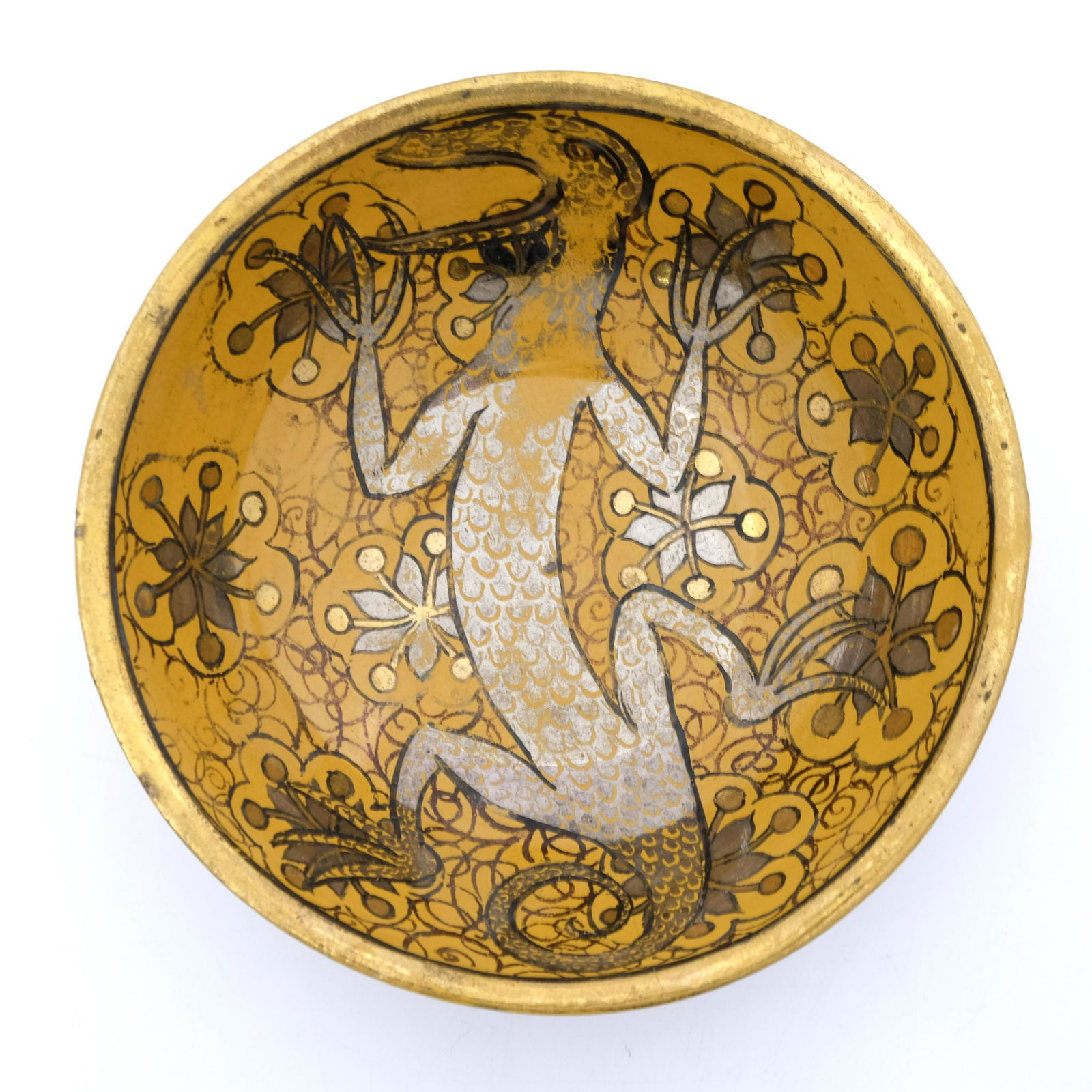 John Pearson, an Arts and Crafts triple: John Pearson, an Arts and Crafts triple lustre bowl, painted with a central lizard in silver scales, on a foliate scroll ground in copper and gold on ochre, decorated with a geometric band of ovals, 1