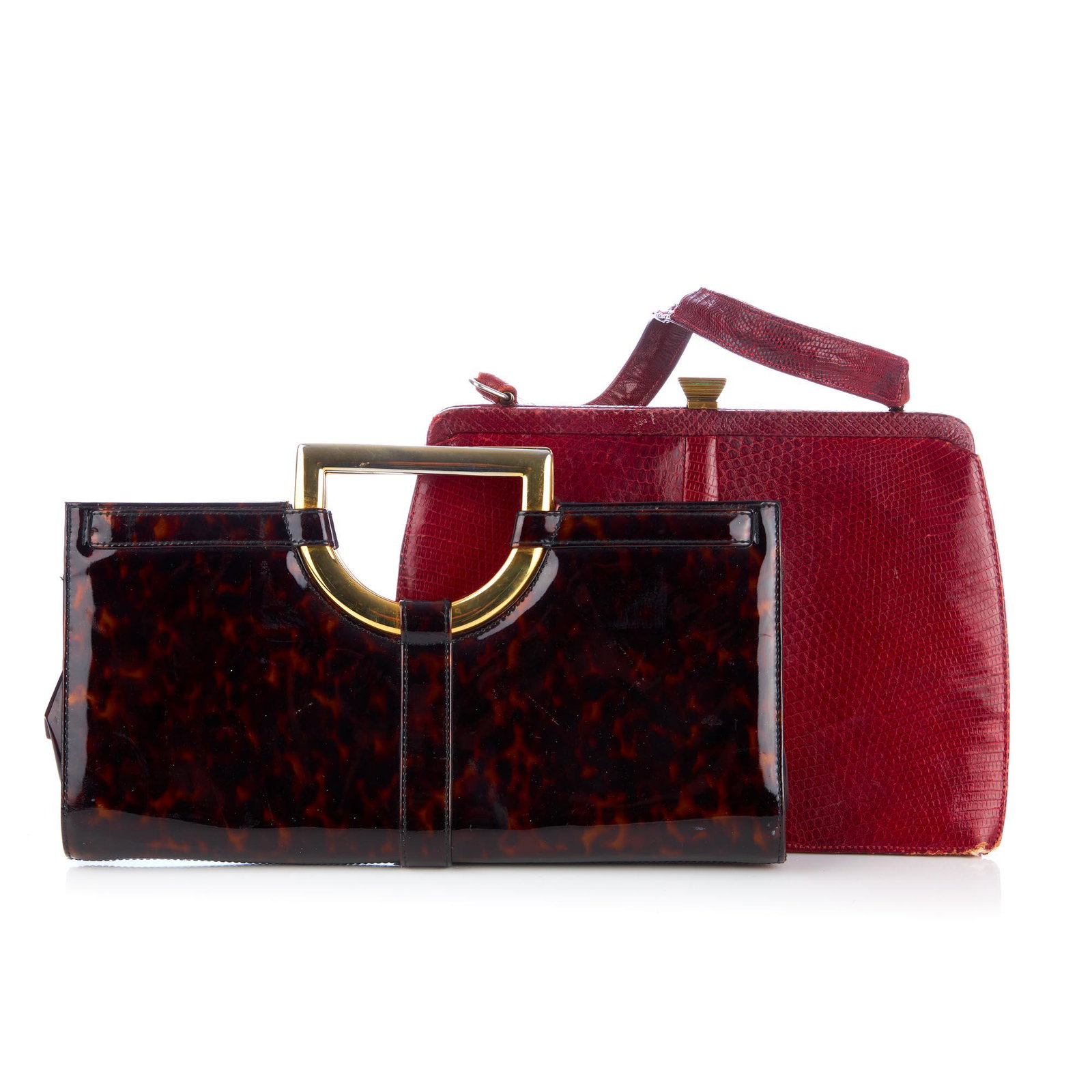 Two vintage designer handbags, to includ: Two vintage designer handbags, to include a tortoiseshell patterned patent leather handbag by Stuart Weitzman for Russell & Bromley, featuring a gold-tone metal top handle and an optional fold-out sho