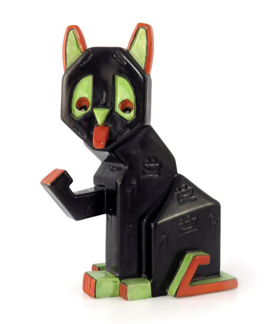 Louis Wain for Amphora, a large Cubist p: Louis Wain for Amphora, a large Cubist pottery Lucky Futurist Cat spill vase, circa 1915, modelled with one paw raised, tongue out, painted in black with green and orange highlights, moulded meow meow