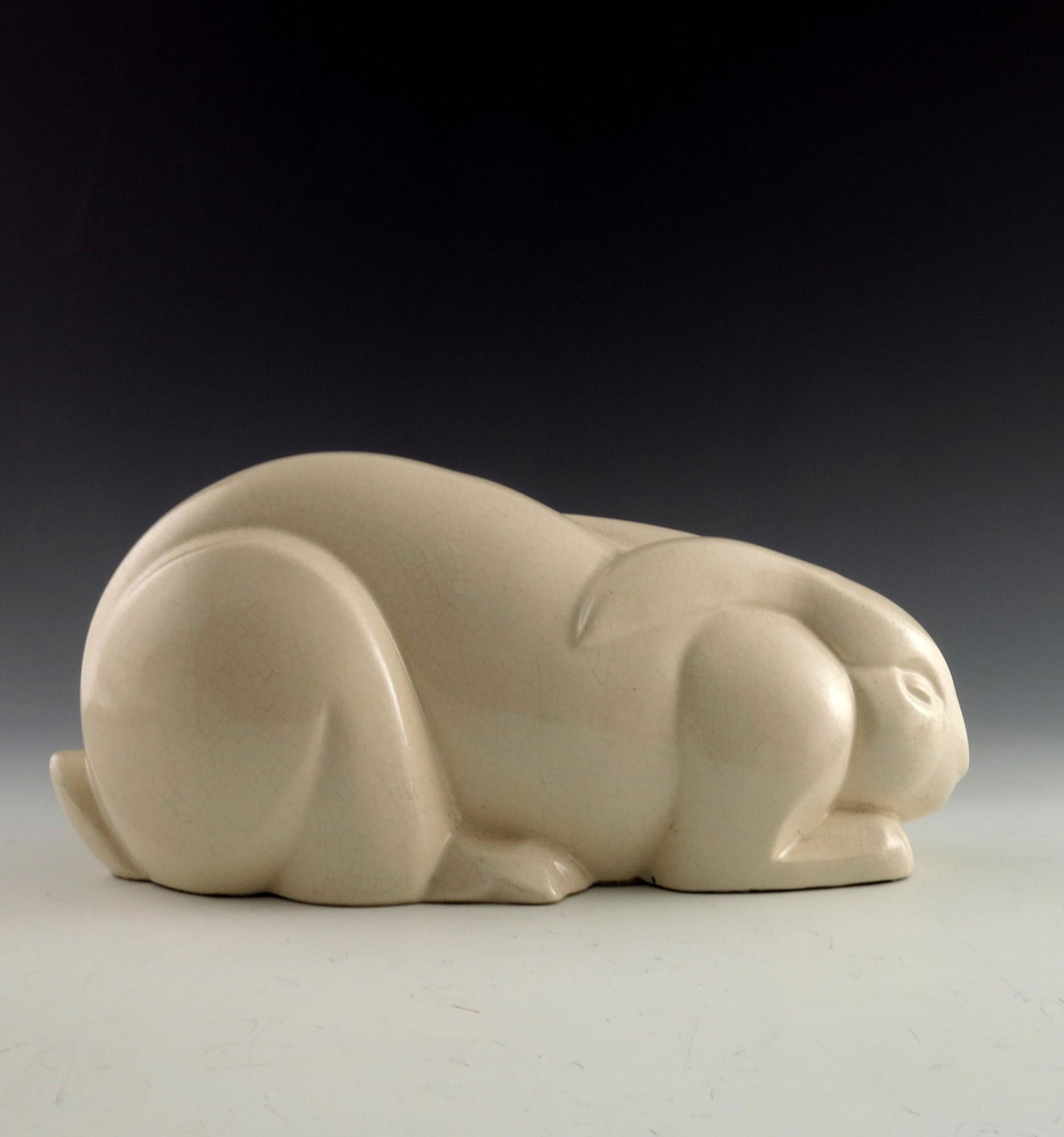Charles Lemanceau, an Art Deco rabbit, c: Charles Lemanceau, an Art Deco rabbit, circa 1929, modelled crouching, white glazed, 36cm long