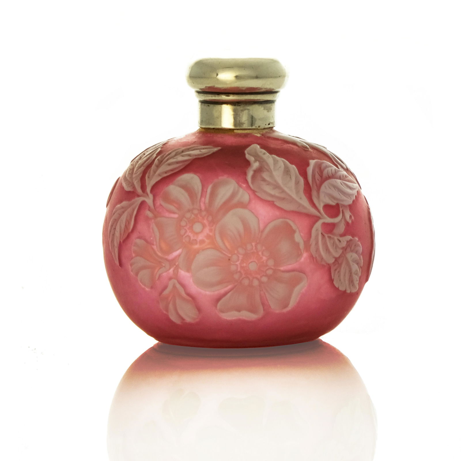 Thomas Webb and Sons, a cameo glass scen: Thomas Webb and Sons, a cameo glass scent bottle, circa 1880, spherical form, white over pink, carved with dog roses, silver screw cap, 6cm high