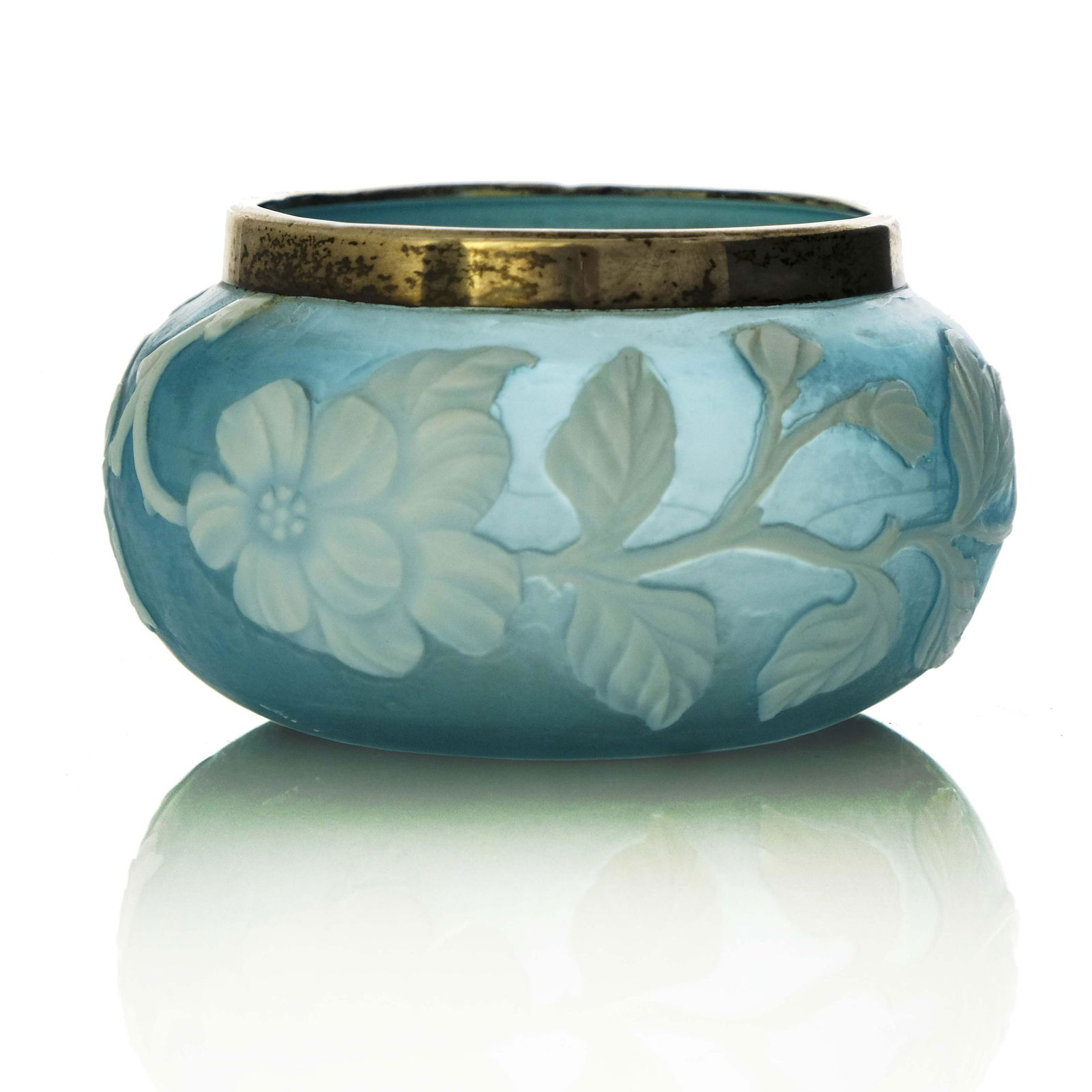 Thomas Webb and Sons, a cameo glass bowl: Thomas Webb and Sons, a cameo glass bowl, circa 1885, squat ovoid form, white over blue dog rose design, white metal mounts, 10.5cm diameter