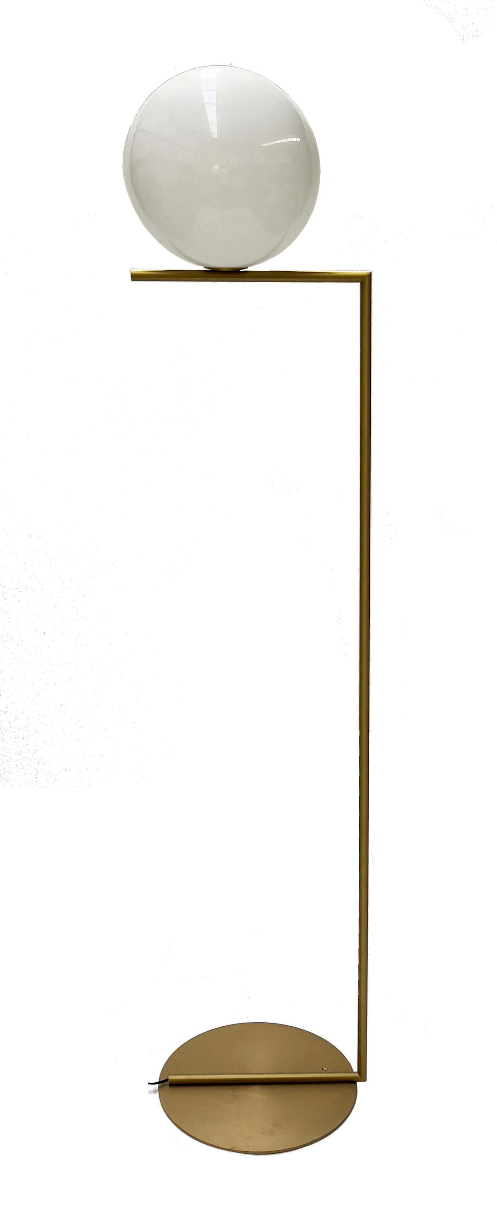 Michael Anastassiades for Flos, 2014, an: Michael Anastassiades for Flos, 2014, an IC F2 floor lamp, spherical blown glass opal diffuser, brushed brass base, circular plinth, 185cm high. Note: the designer sought inspiration from a contact ju