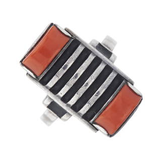 Theodor Fahrner, an Art Deco silver, cor: Theodor Fahrner, an Art Deco silver, coral cabochon and black enamel dress ring, with black enamel shoulders, maker's marks for Theodor Fahrner, band stamped 935, ring size Q, 5.4g