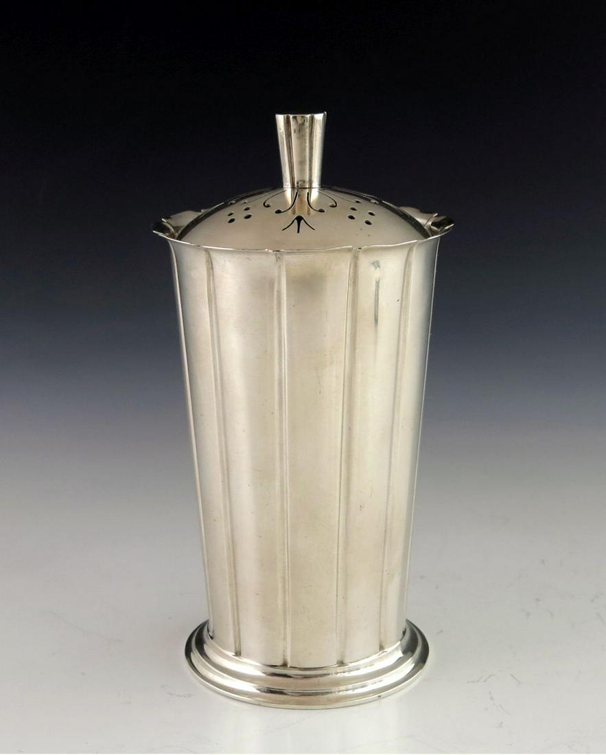 Keith Murray for Mappin and Webb, an Art: Keith Murray for Mappin and Webb, an Art Deco silver sugar shaker, London 1937, fluted conical form with slightly splayed and crenelated rim, on a stepped foot, the inset domed cover with conical fini