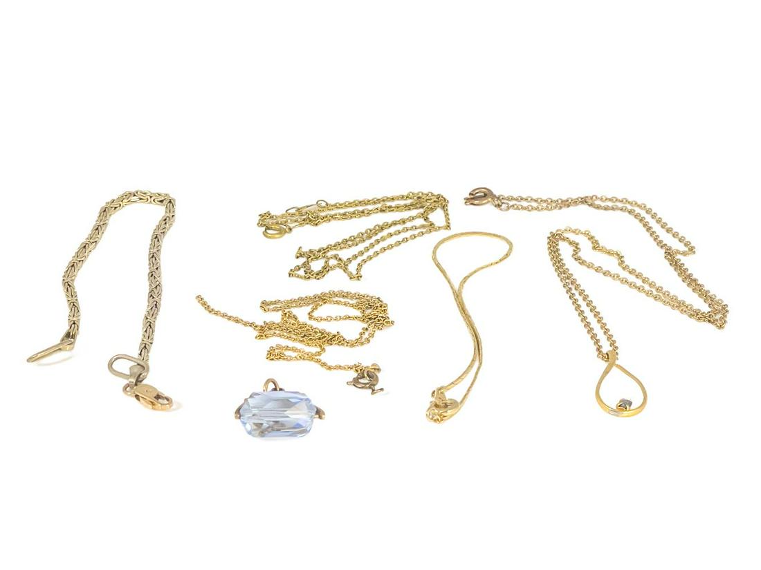 A collection of gold chains, including p: A collection of gold chains, including pendant and rotating fob charm, 17.5g