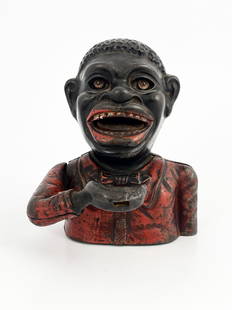 A cast iron mechanical money bank, John: A cast iron mechanical money bank, John Harper & Co, circa 1900, modelled as black man with red jacket, stamped Made in England to base, 17cm high