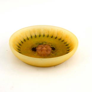 Henri Mercier for Amalric Walter, a pate: Henri Mercier for Amalric Walter, a pate de verre glass dish, circa 1925, circular, relief moulded Bacchus mask within a ribbon wreath border, marbled yellow, pink and blue, intaglio marks h mercier A