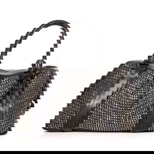 Burberry, a studded Knight holdall bag, : Burberry, a studded Knight holdall bag, crafted from black leather featuring a gunmetal studded exterior, with looping leather handles, two interior compartments with top zip fastenings, and black jac