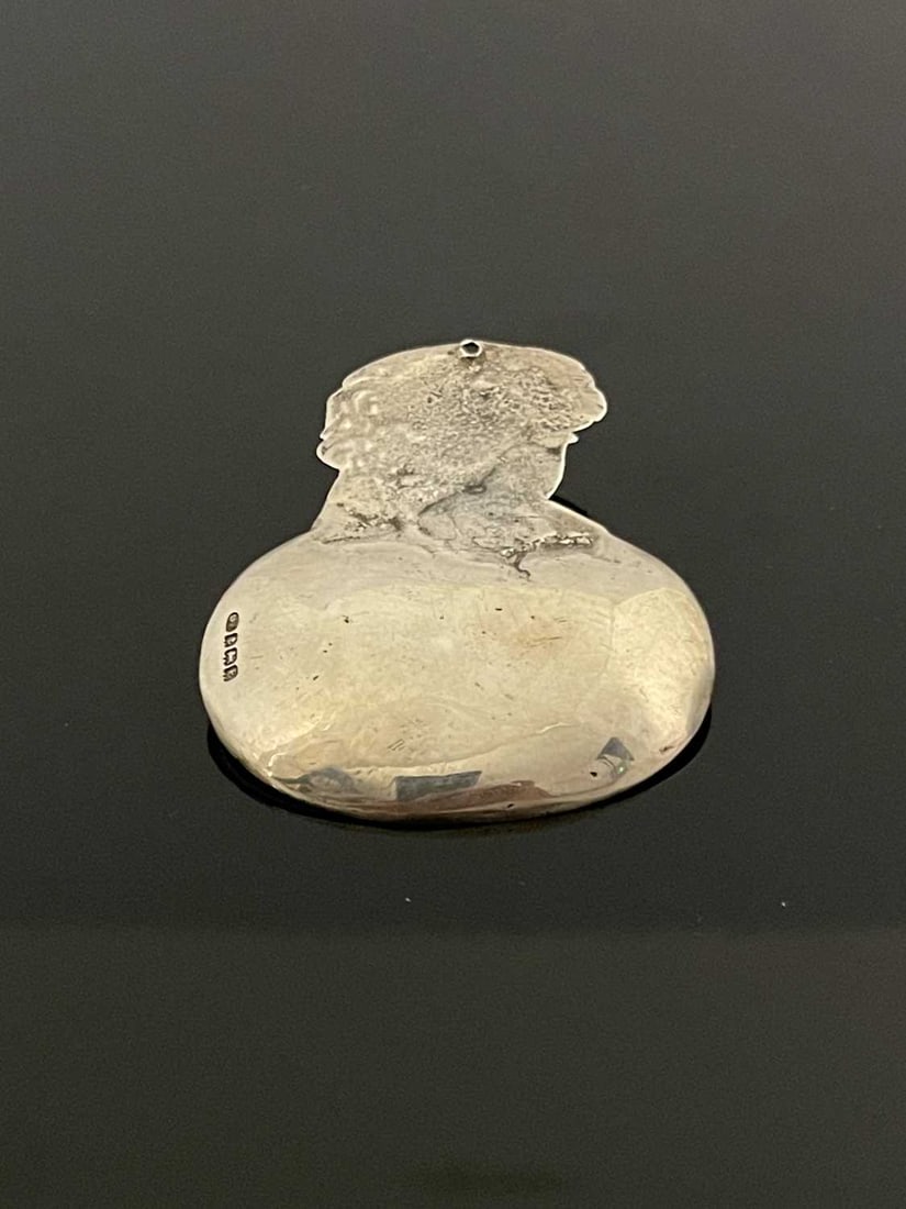 Bernard Instone, an Arts and Crafts Word: Bernard Instone, an Arts and Crafts Wordsworth silver caddy spoon, Birmingham 1929, cast with a bust of the poet, 7cm long, 0.77ozt