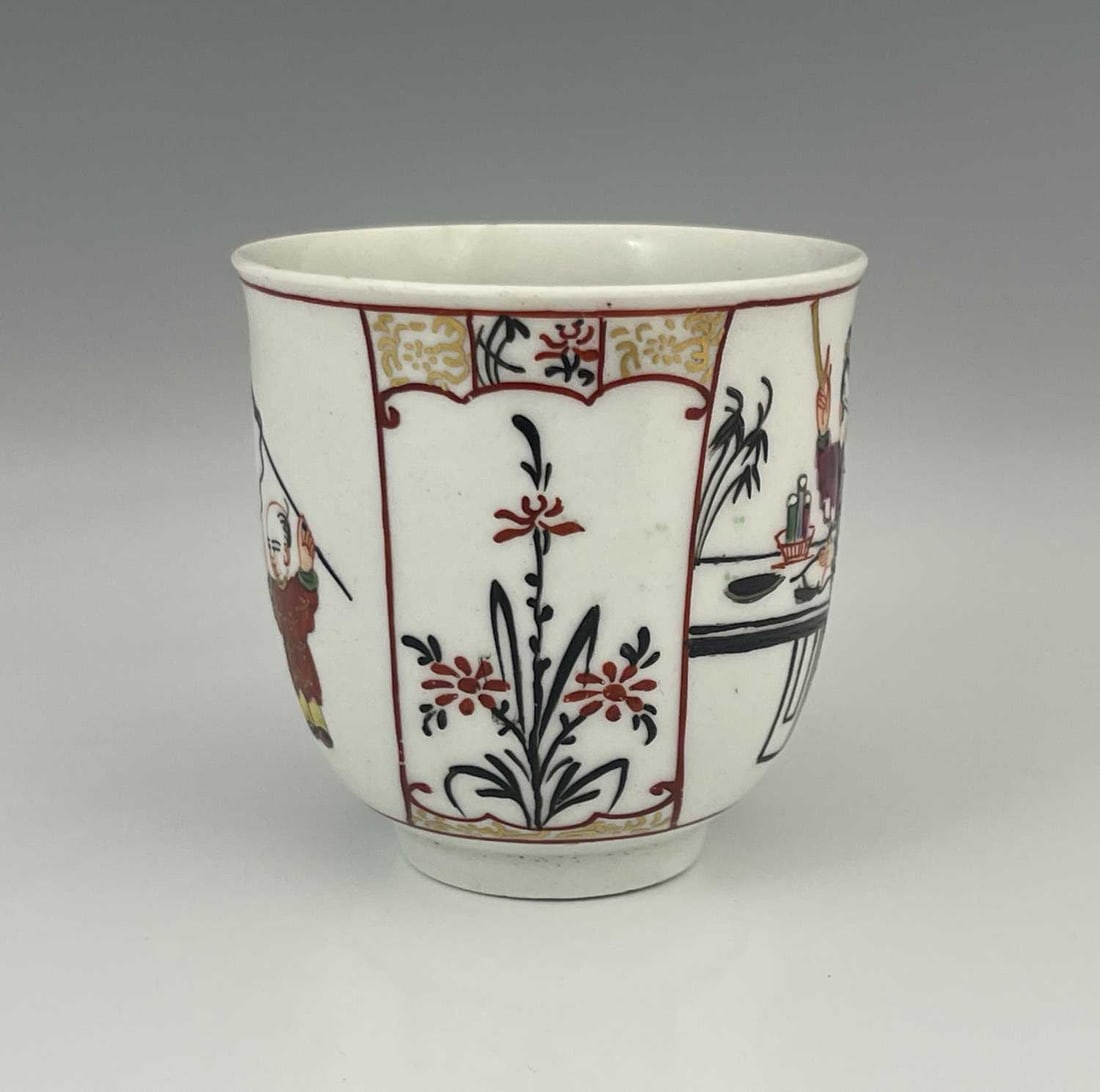 A Worcester polychrome coffee cup, circa: A Worcester polychrome coffee cup, circa 1770, slightly everted rim, painted with Chinese figures, red line borders, jumping boy type figures, 6.5cm high