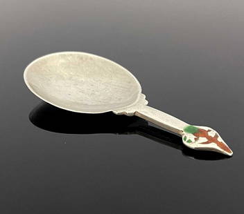 Archibald Knox for Liberty and Co., an A: Archibald Knox for Liberty and Co., an Arts and Crafts silver and enamelled caddy spoon, Birmingham 1902, model 3209, the egg shaped bowl with short stem and pointed leaf finial in green and orange en