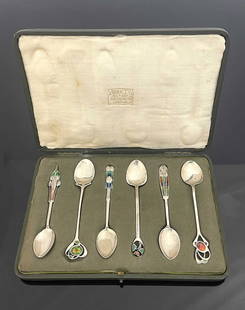 Archibald Knox for Liberty and Co., a ha: Archibald Knox for Liberty and Co., a harlequin set of six Cymric Arts and Crafts silver and enamelled teaspoons, Birmingham 1902, 1903 and 1904, each of a different organic design, some with open