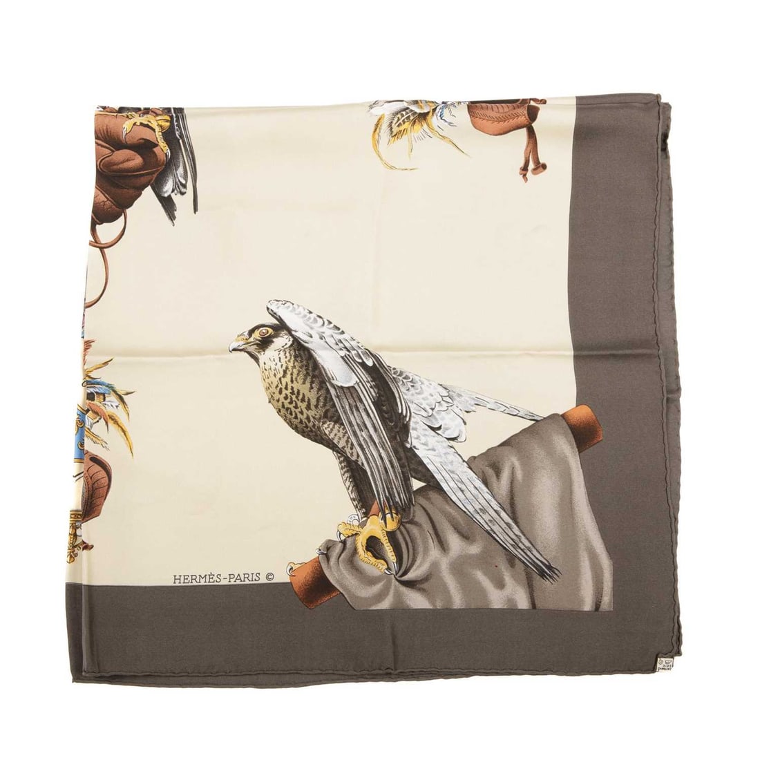Hermes, a Chasse A Vol silk scarf, desig: Hermes, a Chasse A Vol silk scarf, designed by Henri de Linares, first issued in 1962, featuring falcons on a cream background with a grey border, measuring 90 by 90cm