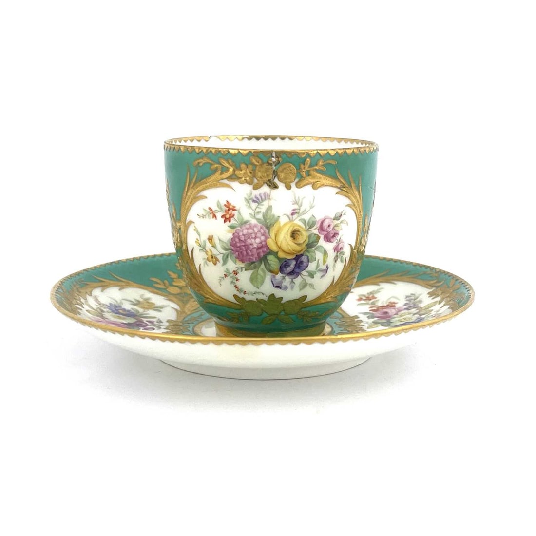 A Minton floral painted and raised paste: A Minton floral painted and raised paste gilt coffee cup and saucer, circa 1850, in the Sevres style, Chartreuse green ground with palm frond and floral cartouches decorated with bouquets of flowers, 