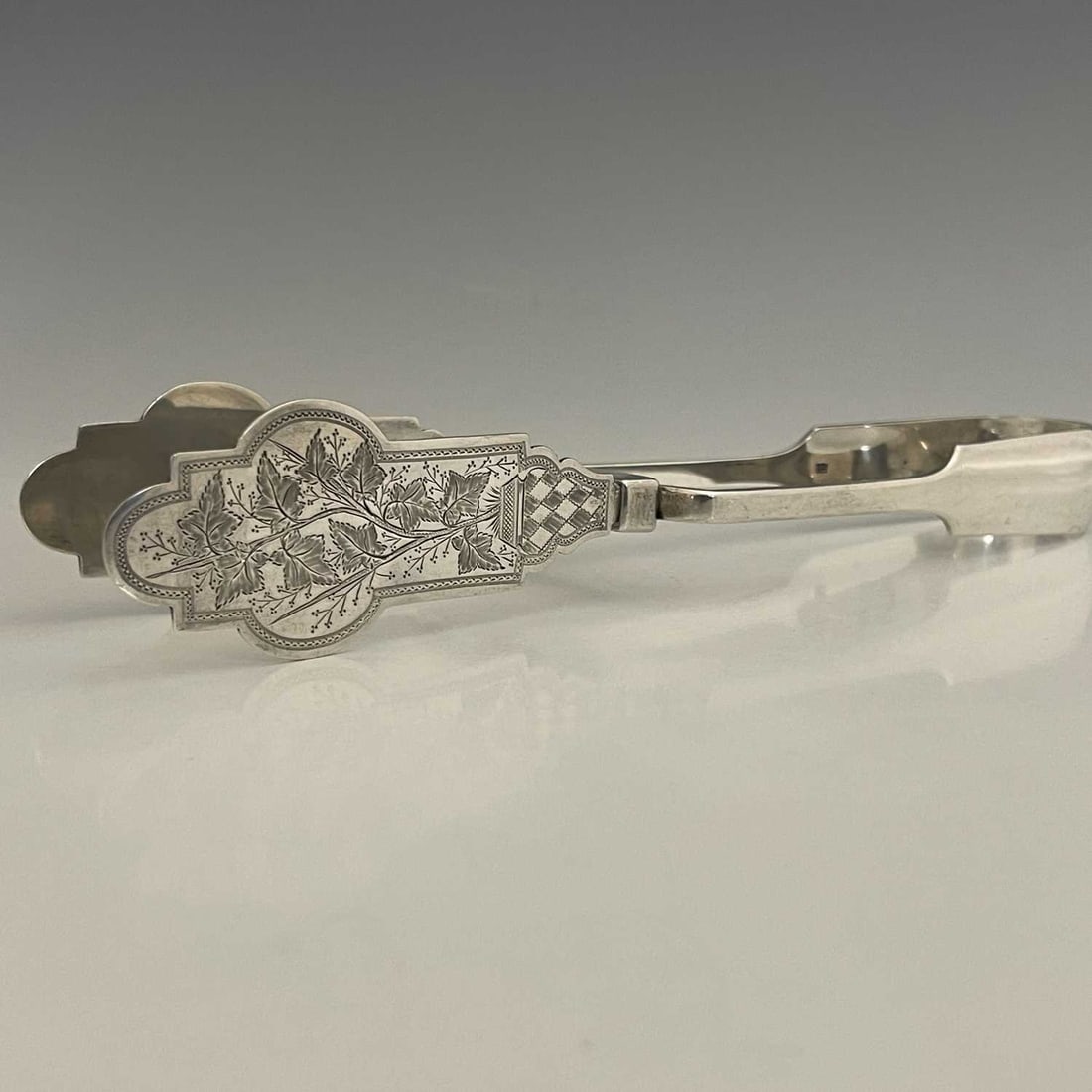 A Victorian silver single pair of servin (1 of 3)