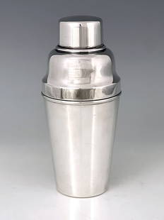 A large Art Deco silver plated cocktail shaker, William Suckling, Kingsway Plate, circa 1930,: A large Art Deco silver plated cocktail shaker, William Suckling, Kingsway Plate, circa 1930, conical form with ogee shoulder and domed cylindrical lid, integrated strainer and ice guard, 1.5 pint