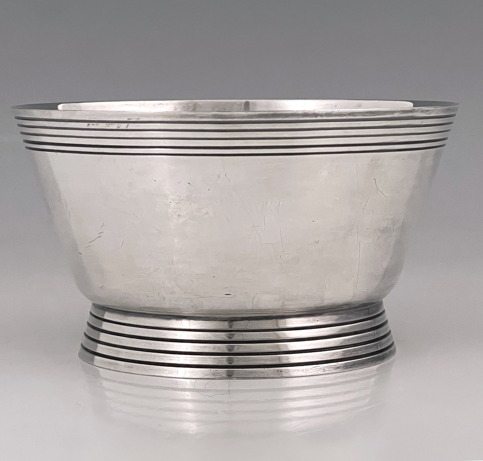 Keith Murray for Mappin and Webb, an Art Deco silver plated bowl, circa 1935, W27688, conical form,: Keith Murray for Mappin and Webb, an Art Deco silver plated bowl, circa 1935, W27688, conical form, with incised concentric ring banding to the rim and root, 10.5cm diameter