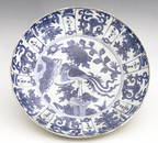 A Chinese blue and white dish, Ming, painted with a bird on rock with peony design, within a