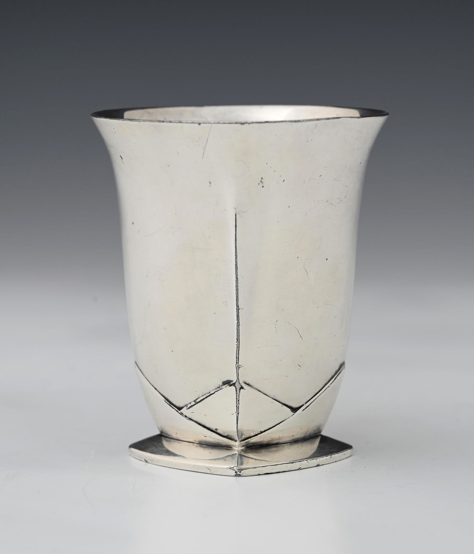 Louis Sue and Andre Mare for Christofle,: Louis Sue and Andre Mare for Christofle, a Gallia Art Deco silver plated beaker, circa 1925, cushioned square section foot with interlocking segmented corners, rising to a flared circular rim, stamped