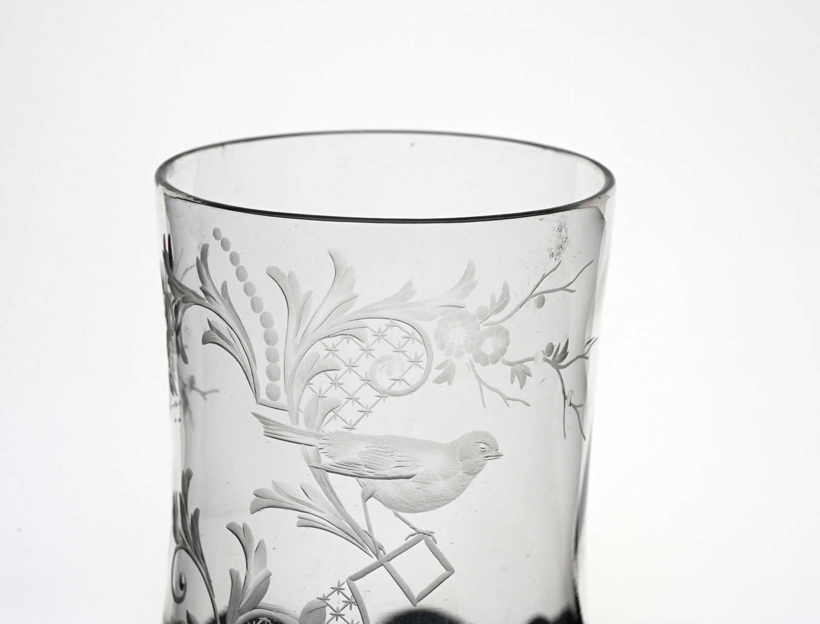 Thomas Webb and Sons, a Belle Epoque eng: Thomas Webb and Sons, a Belle Epoque engraved glass vase, circa 1880, optic wrythen banded bulbous beaker form, engraved and etched with a bird in Rococo foliate scroll and tendril branch of diaper tr