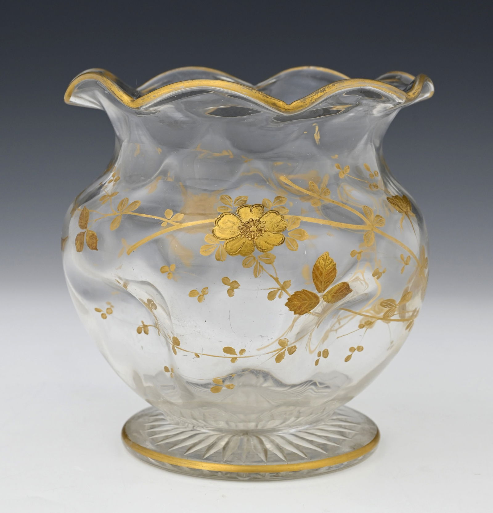 Jules Barbe for Thomas Webb, a gilded gl: Jules Barbe for Thomas Webb, a gilded glass vase, optic scaled and dimpled ovoid footed form with crimped rim, decorated in the round with a raised and tooled gilt dog rose, 17.5cm high