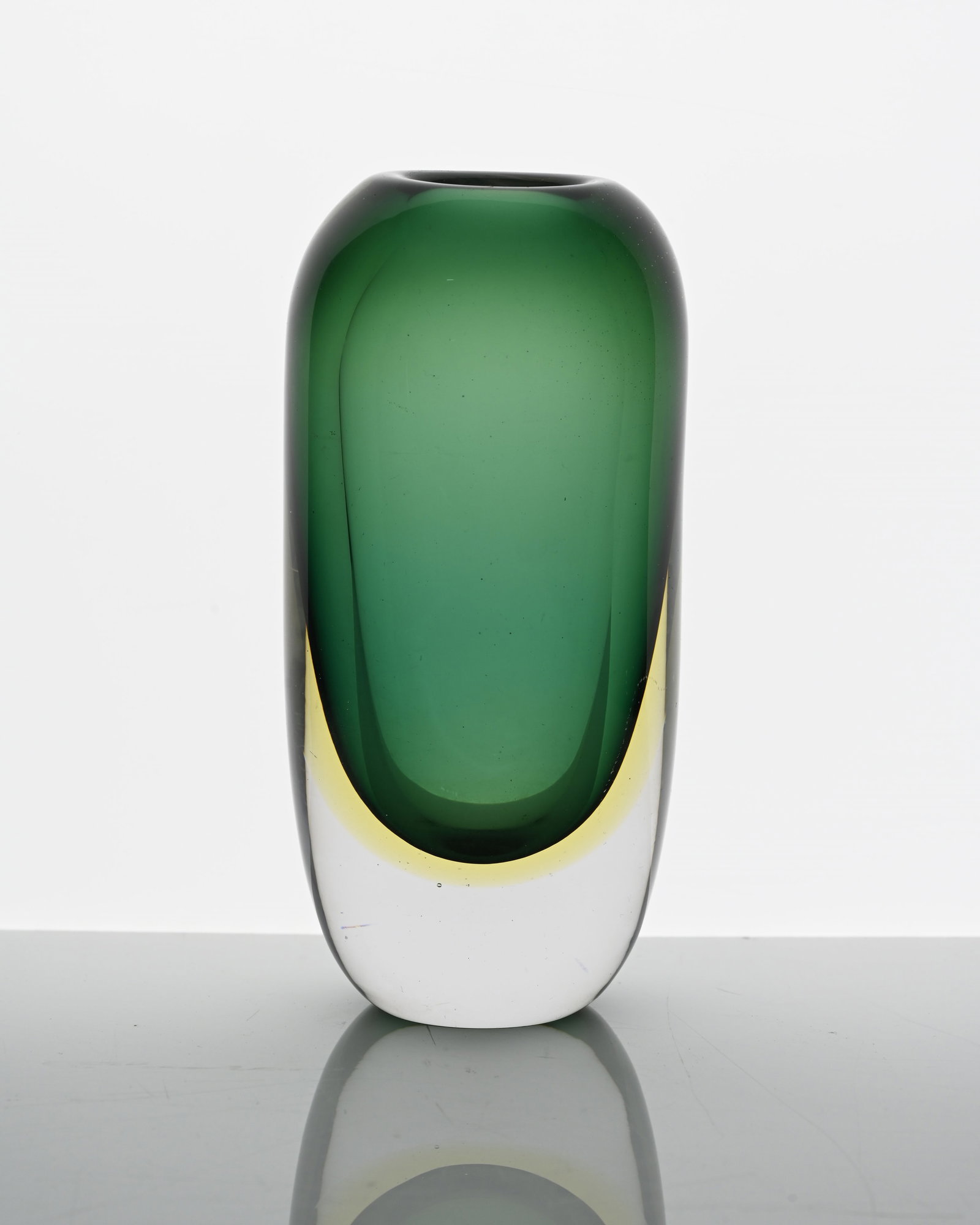 Gunnar Ander for Lindshammer, a triple c: Gunnar Ander for Lindshammer, a triple cased Sommerso glass vase, circa 1960, ovoid pellet form, colourless over amber and green, incised marks, 1302/145, 15.5cm high