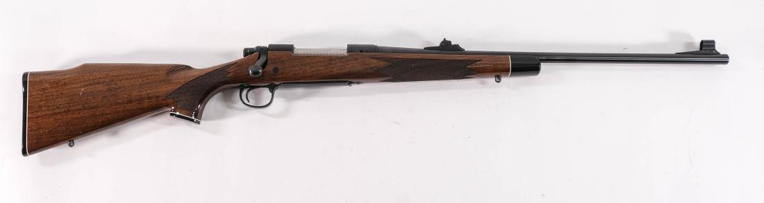 Remington 700 Rifle .270 Fancy wood: Wood stock is beautiful with black ebony features and high gloss finish. Date code is AA. Excellent overall with only a few scuffs and storage marks.