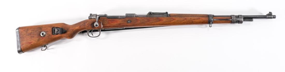 Mauser K98 Bolt Action Rifle: Mauser K98 in 8mm Mauser with a 25" barrel. This gun has no matching serial numbers but has all period correct parts. The gun has Waffenamt all around, stamped 1944. The gun is overall in very good co