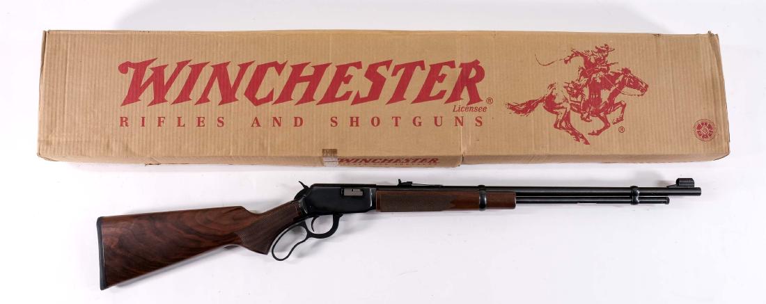 Winchester 9422M Lever Action Rifle .22 wmr: Classic Model 94 Lever Action Rifle Chambered for the .22 Mag cartridge. New Old Stock, Unfired outside of the factory, with matching box and papers.