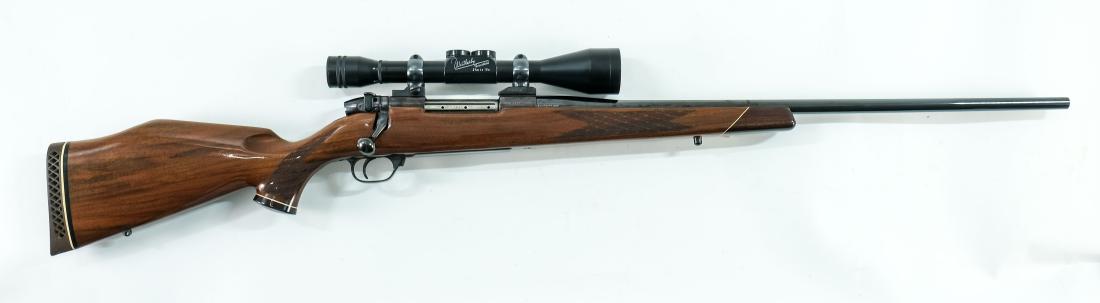 Weatherby Mark V Rifle 270 Magnum: New Old Stock Weatherby Bolt action Mark V Rifle chambered in .270 Magnum. Tapered 24" Barrel, Checkered Pistol Grip Stock with Banding, and mounted with a Weatherby Variabel 2 3/4X to 10X Scope with 
