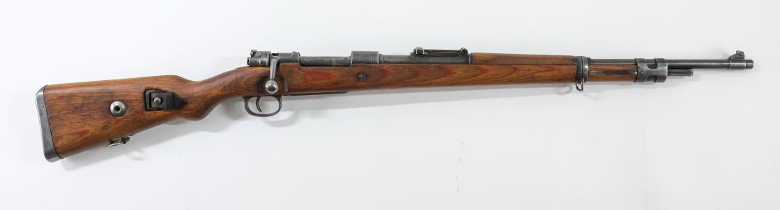 Mauser K98 Bolt Action Rifle: Mauser K98 in 8mm Mauser with a 25" barrel. This gun has no matching serial numbers but has all period correct parts. The gun has Waffenamt all around, stamped 1944. The gun is overall in very good co