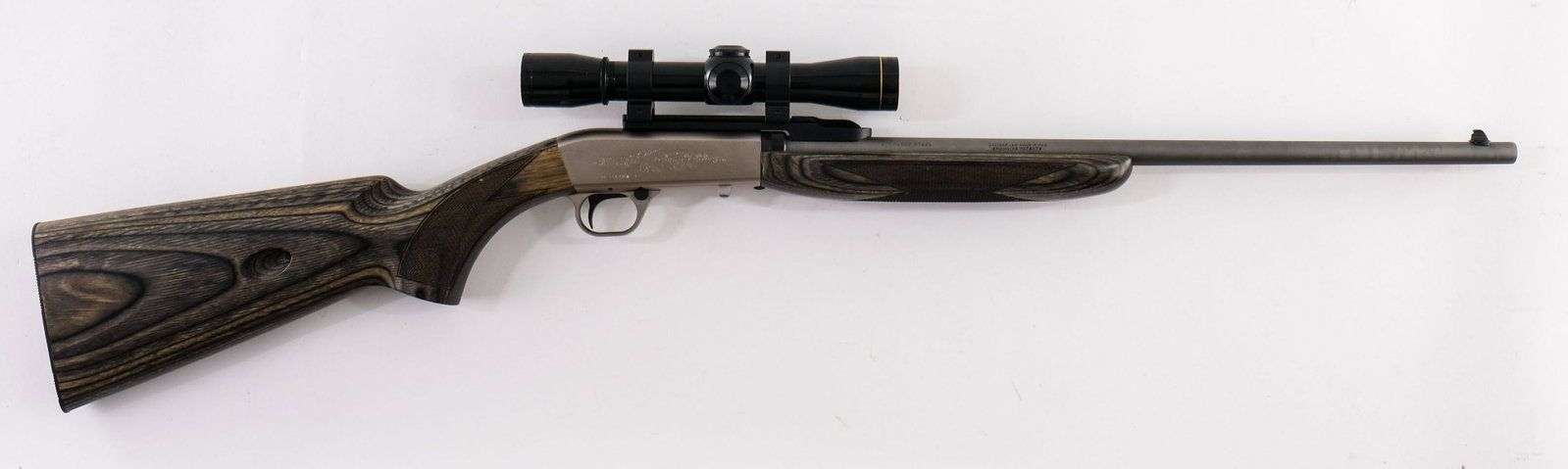 Browning SA-22 .22 Takedown Rifle: Stainless Steel 19" bbl, Engraved Stainless Receiver. Checkered Laminate Stocks, Mounted with a Leupold 4X RF Special Scope with Clear Optics. Scope is barrel mounted. Excellent, Clean Condition. Barr