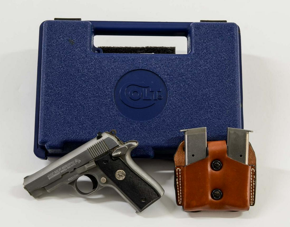 Colt MK IV Series 80 Government Model 380: Stainless Steel Colt Mustang Style 380 Auto Pistol with 3.25" barrel, Three Seven Round Original Colt Magazines, and a leather magazine keeper. In original Box with papers. Gun in used with contact ma