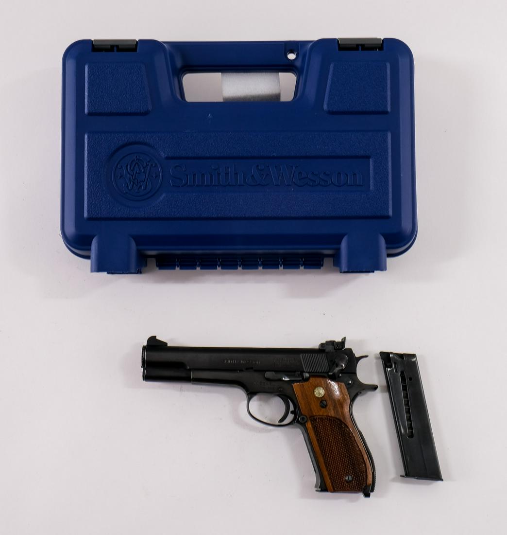 Smith & Wesson 52-2 .38 Master Pistol: The Famous S&W Bullseye Target Shooting Pistol, chambered for .38 Special wadcutter bullets. Produced 1970-1992. with the improved extractor. This version has a 5" barrel, blued slide and frame, serra