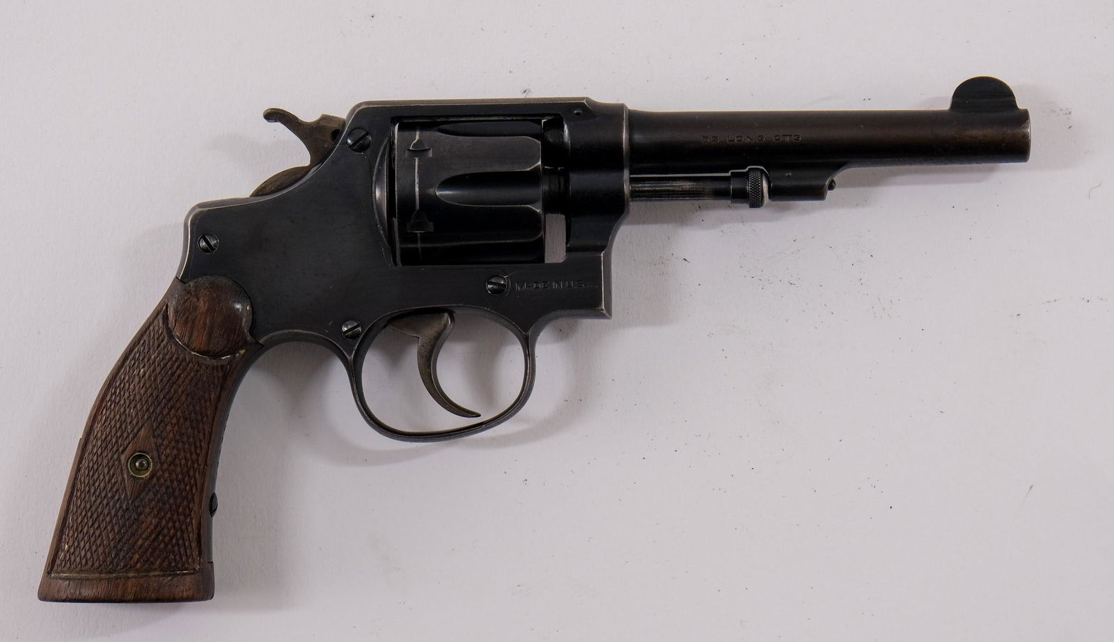 Smith & Wesson .32 Hand Ejector: I frame revolver 5 screw with pinned bbl. 6-shot. 4 1/4" bbl with Service type front sight. Knurled round end extractor rod. Blued finish with case colored hammer and trigger. Regulation police type g