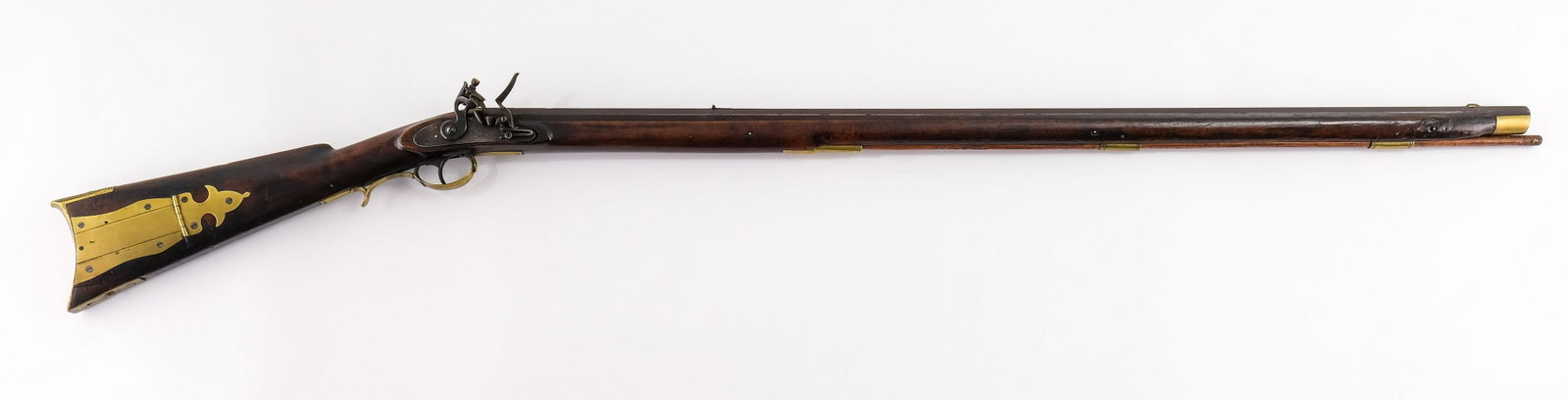 52 Cal Full Stock Flintlock J&W. Aston: Full length stock flintlock rifle with eight-groove rifling in .52 caliber. Silver blade fore-sight and small v groove rear sight. The lock plate shows worn engraving with the plate marked "J&W. Aston