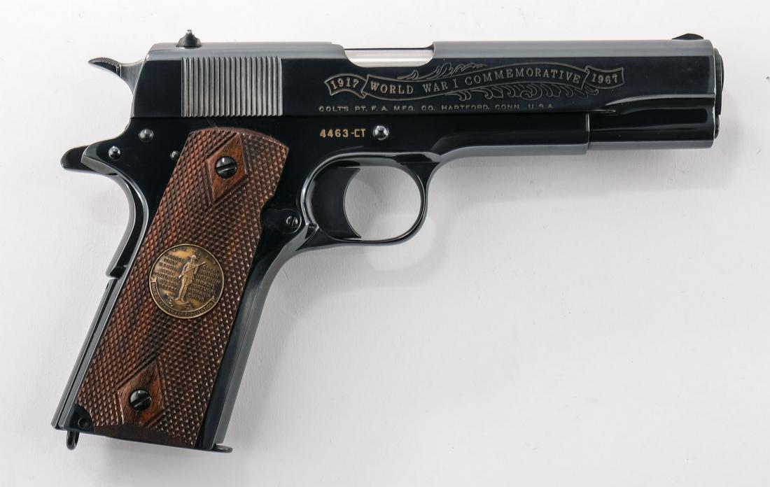 Colt WWI Comm 1911 Pre 70 Series Pistol: Colt World 1917-1967 War One Commemorative Chateau Thierry model 1911 Pistol in 45 ACP. with 5" bbl, One 8-rd magazine. Features battle scene on slide, and gold rampant colt medallion. Checkered wood 