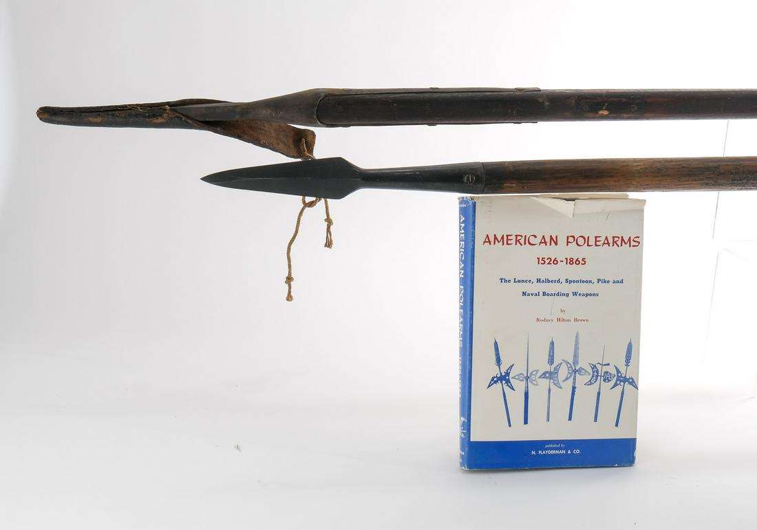 Two Naval Boarding Pikes: Likely American, 18th and or 19th Century. The longer of the two resembling a model of 1816 with original Leather Scabbard with tie. Unmarked, riveted to a square wood pole, with old rivets and missin