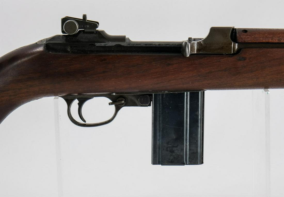 Inland GM M1 Rifle .30 Carbine: Inland DIV M1 Carbine in .30 carbine with two fifteen round removable magazines and a 18" barrel. The metal butt plate is in good condition with metal oxidation and light wear. The wood stock is in ve