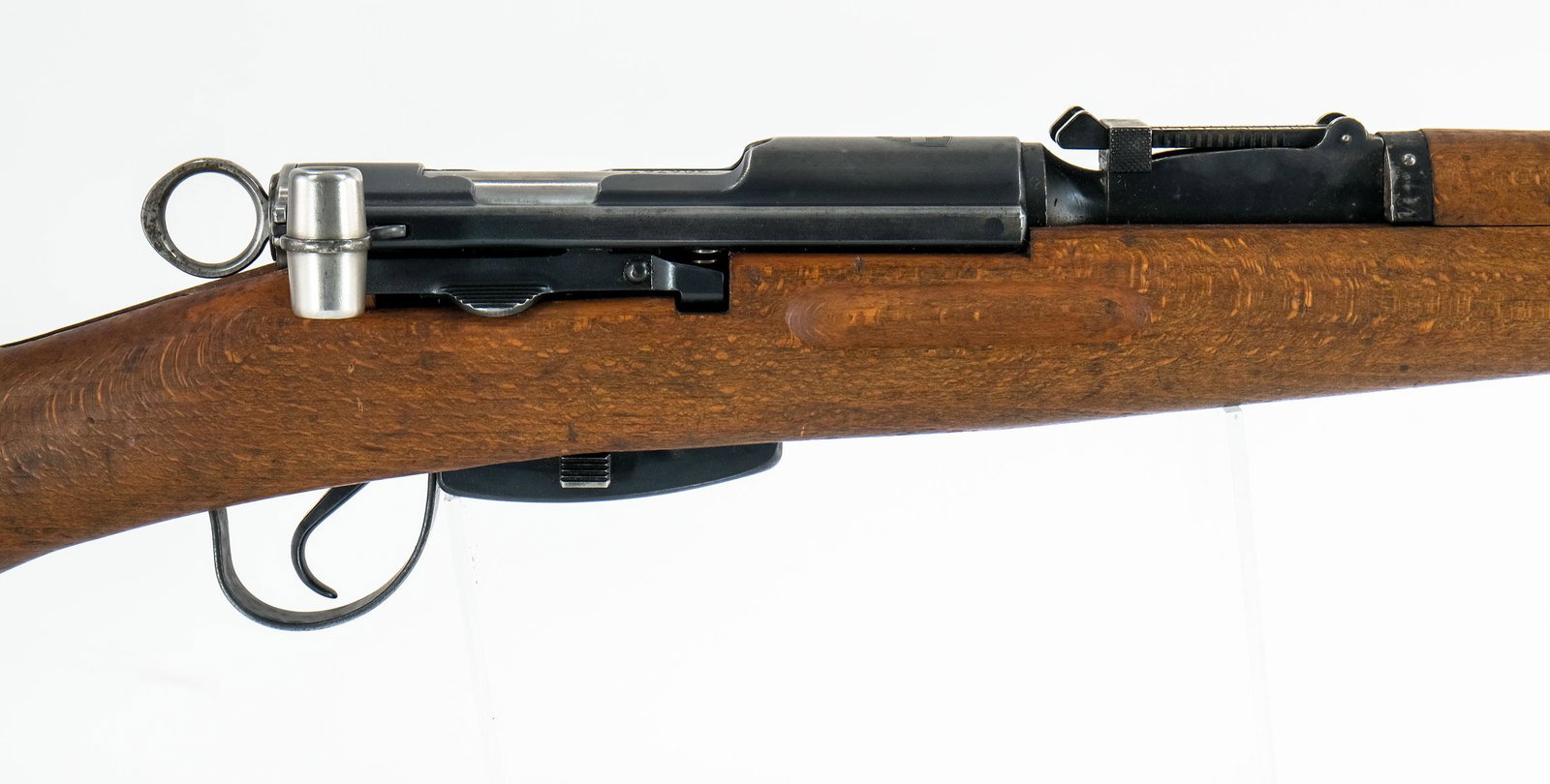 Swiss K31 Rifle 7.5X55mm Straight Pull: Swiss Army model K31 in 7.5X55mm Swiss with a six round removable magazine and a 24" barrel. The metal butt plate is in fair condition with moderate metal oxidation throughout. The walnut stock with S