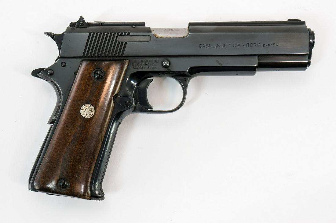 Llama 1911 SA .45 ACP Pistol: Llama 1911 in single action .45 ACP with a seven round removable magazine and a 5" barrel. The Llama wood grip plates are in good condition with moderate handling wear and hard contact marks on the ma