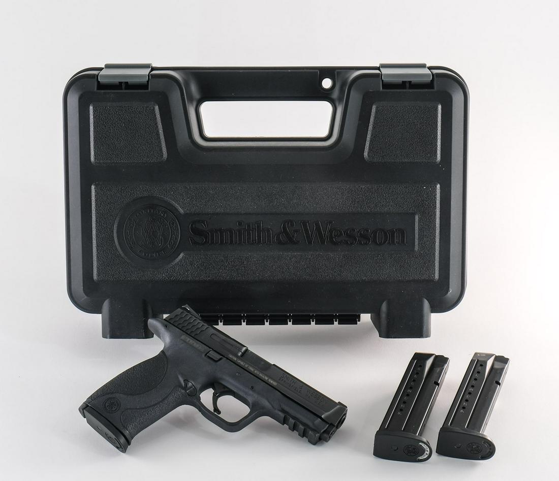 Smith & Wesson M&P 9 9mm pistol: Smith & Wesson M&P 9 in 9mm with three high capacity seventeen round removable magazines and a 5" barrel. The polymer grip and frame are in excellent condition with no handling marks or scratches. The