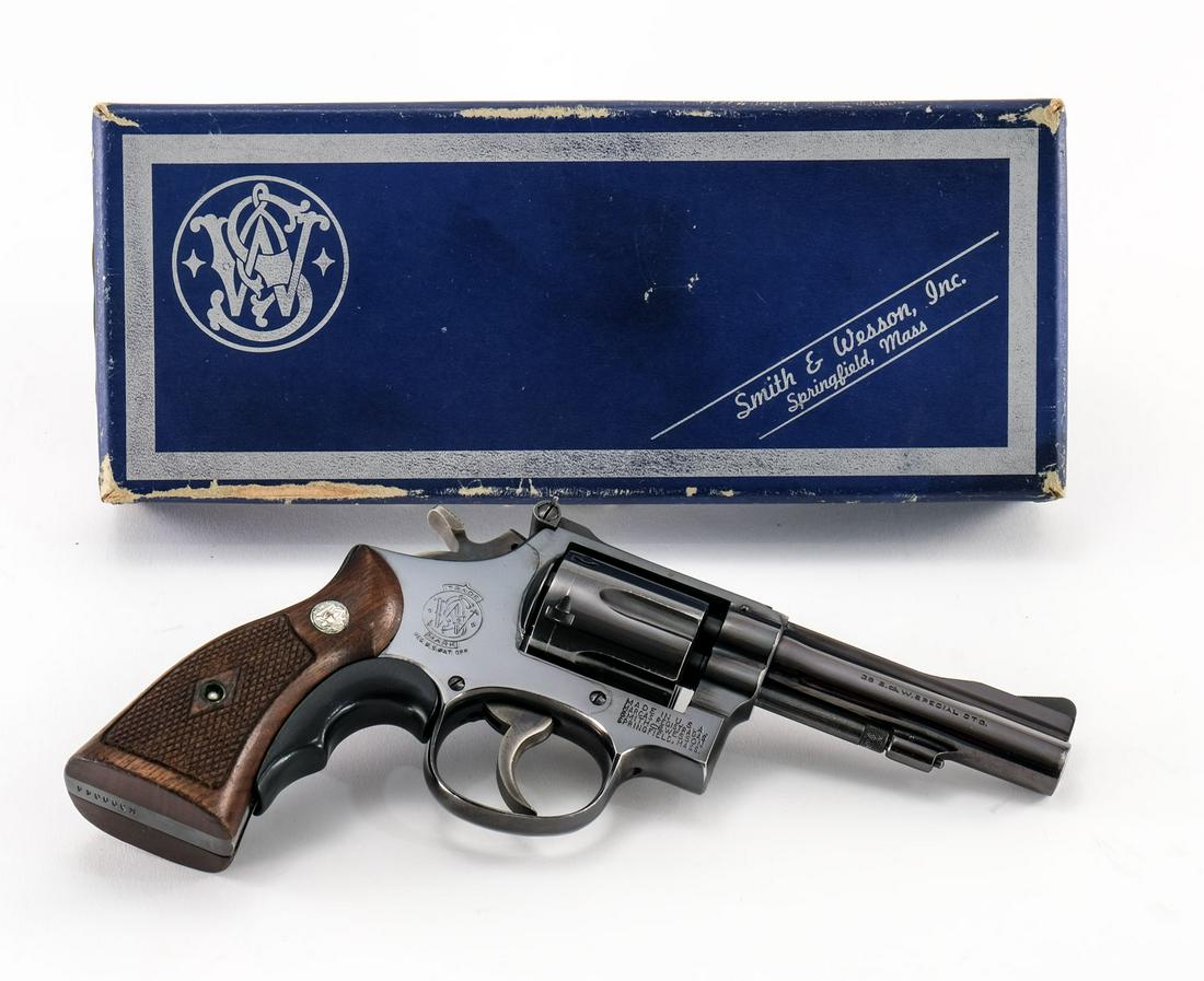 Smith & Wesson 15 K-38 Revolver .38 Spl: Smith & Wesson model 15 K-38 Combat Masterpiece in .38 special with a six round capacity and a 4" barrel. The original numbers matching walnut "SW" grips are in very good condition with light handling