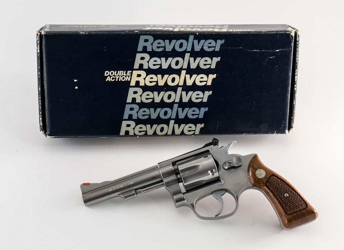 Smith & Wesson 63 .22 LR Revolver: Smith & Wesson model 63 in .22 long rifle with a six round capacity and a 4" barrel. The original walnut "SW" grips are in excellent condition free of damage or wear. The polished stainless steel fram